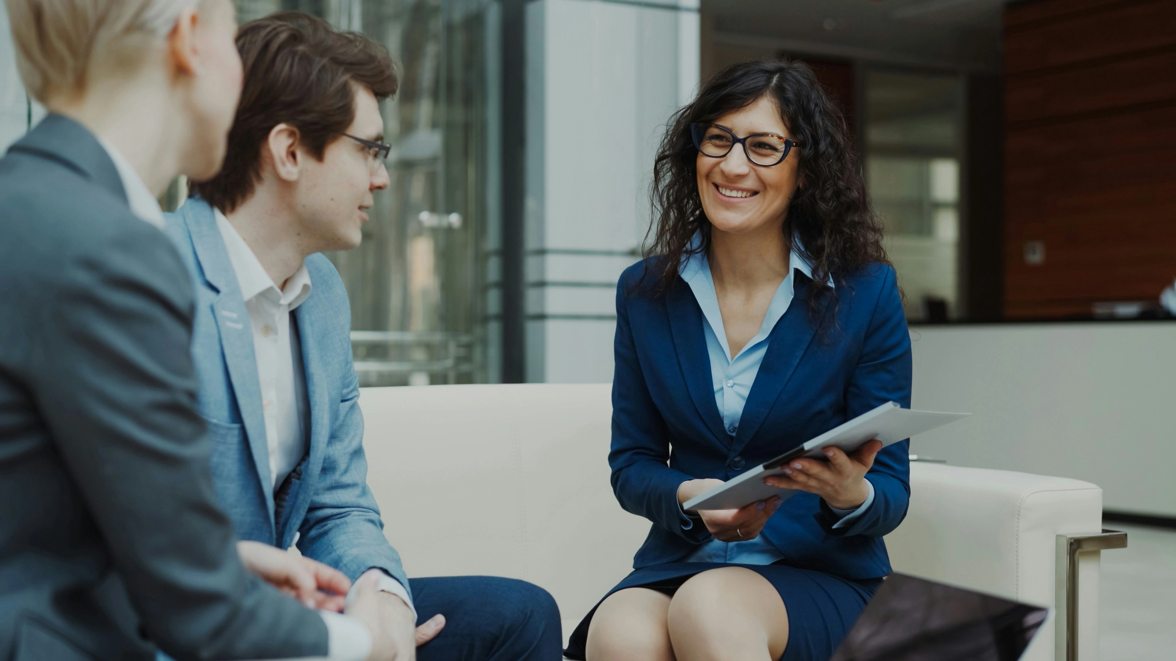 Immigration attorney consulting with clients in an office